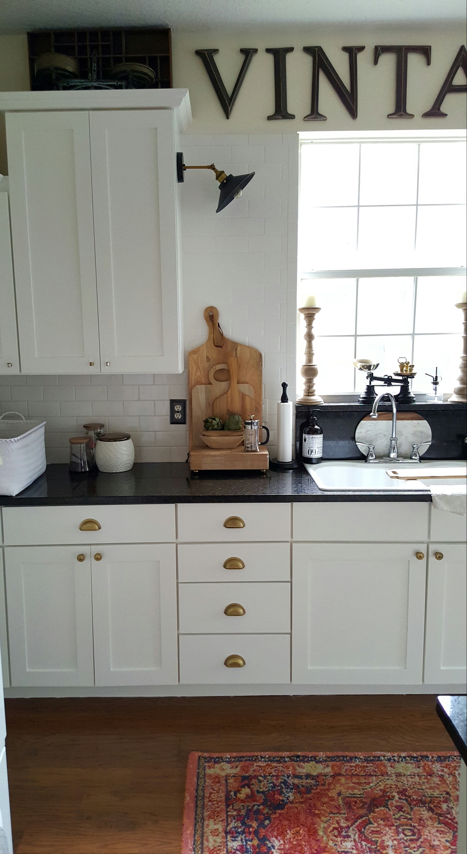 White Farmhouse Industrial Kitchen makeover Painted Cabinets Wood Bread Boards Coffee Bar