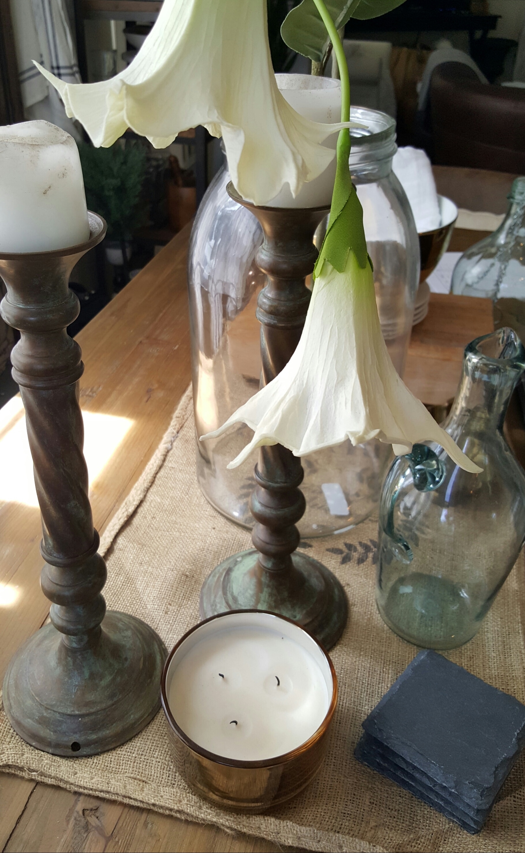 rustic vintage tablescape decor white flower copper candle glass bottle