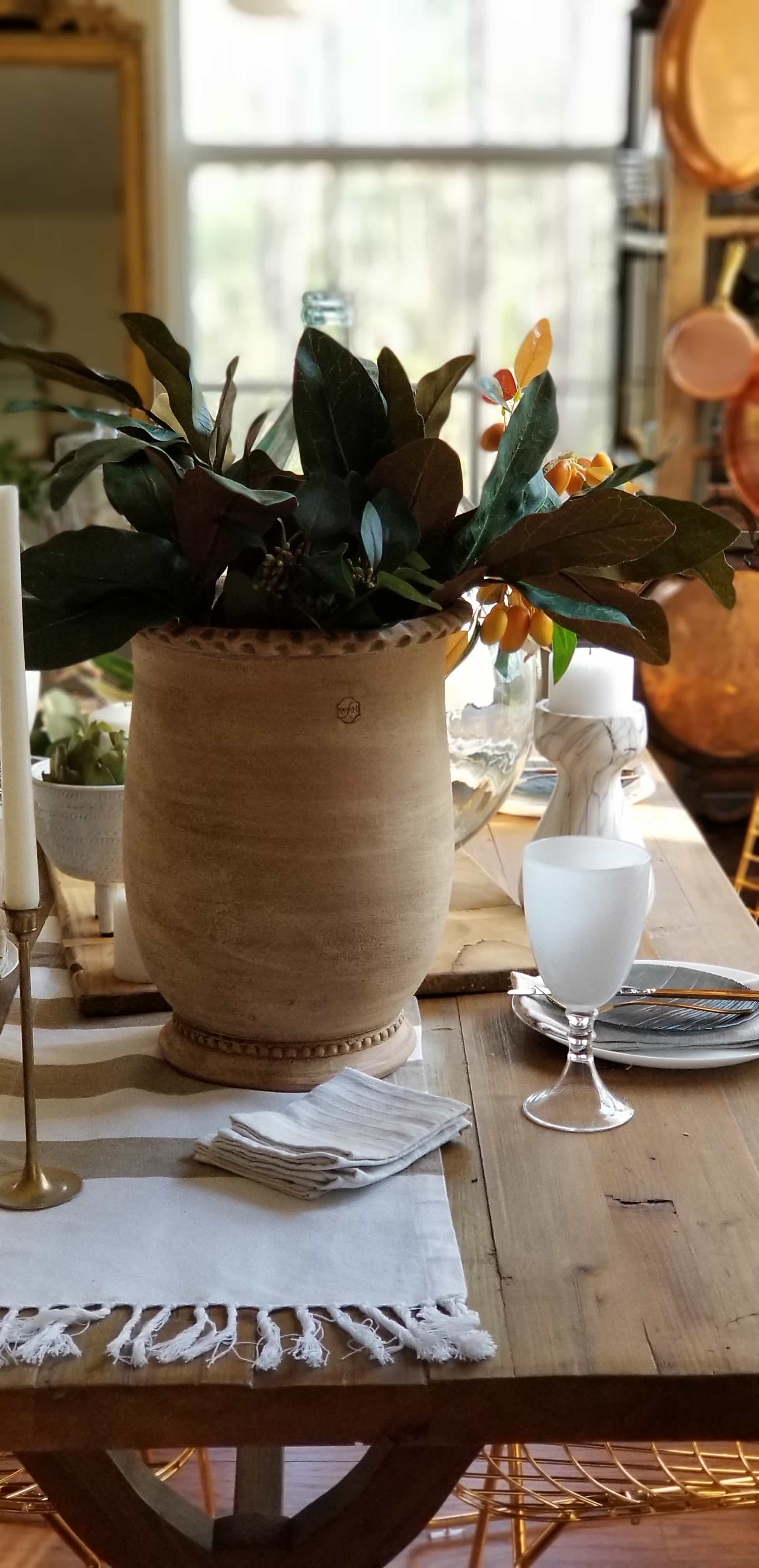 Rustic Modern European Boho Mediterranean Farmhouse Glam Dining Room Table Tablescape Joss & Main Gold Chair Terra Cotta Pots Glass Bottle Wood White Flowers Magnolia Eucalyptus Mango Stem Decor Design Inspiration Spring