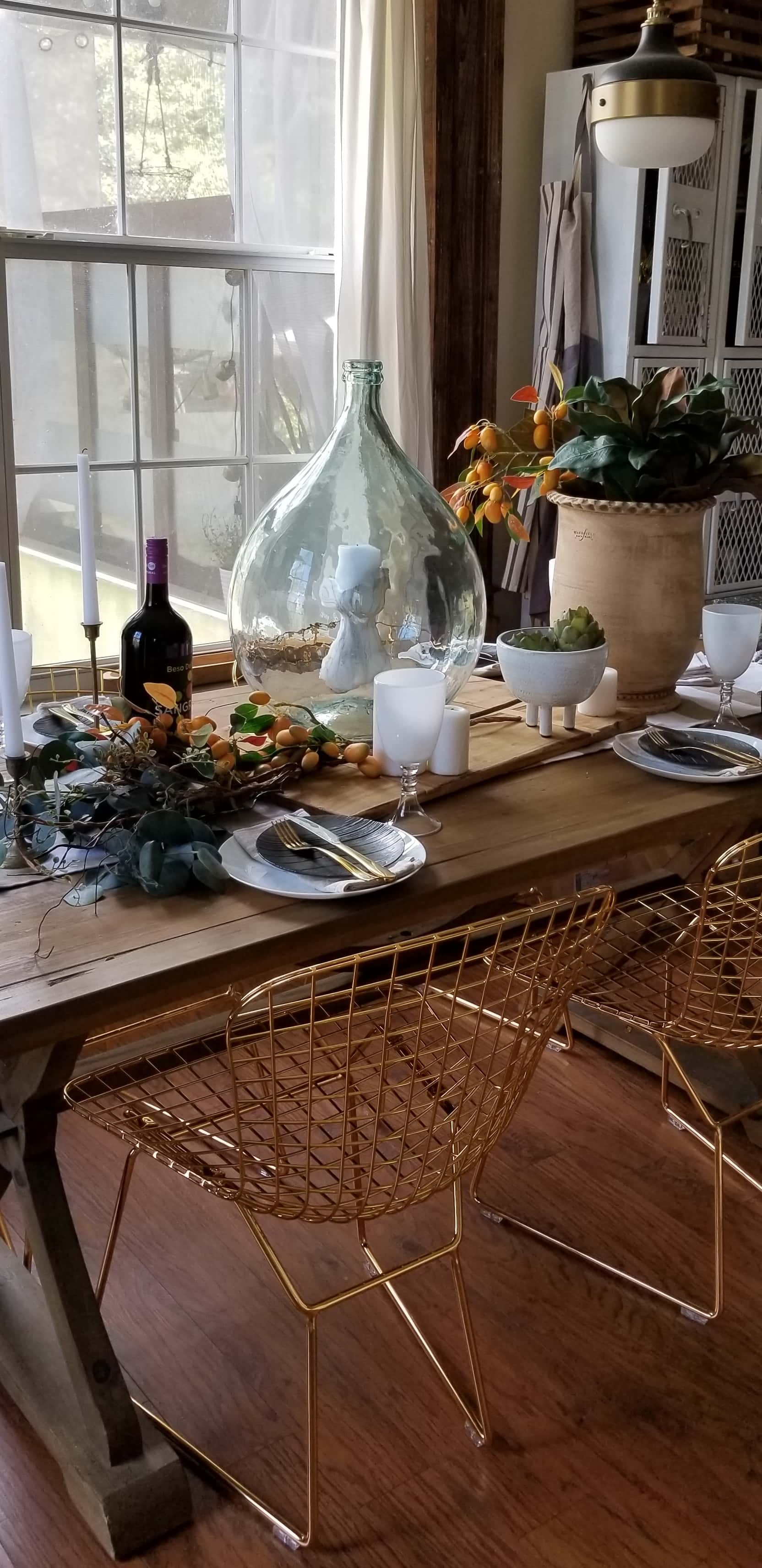 Rustic Modern European Boho Mediterranean Farmhouse Glam Dining Room Table Tablescape Joss & Main Gold Chair Terra Cotta Pots Glass Bottle Wood White Flowers Magnolia Eucalyptus Mango Stem Decor Design Inspiration Spring