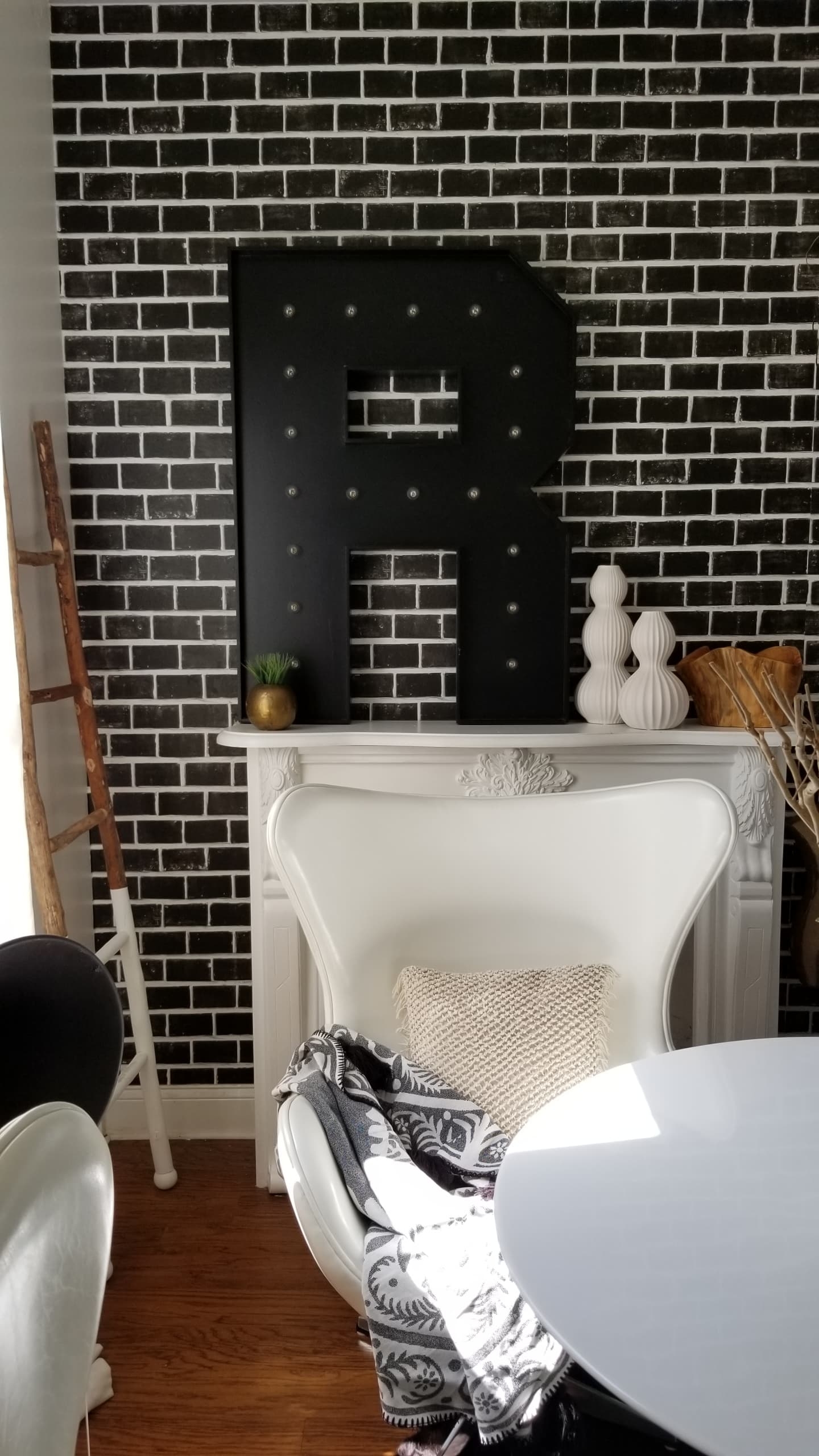 One Room Challenge Urban Chic She Den Office Makeover Black Brick Wallpaper Industrial Glam Modern Bohemian Decor design inspiration white wood chandelier rattan ottoman tulip table scandinavian interiors open shelving