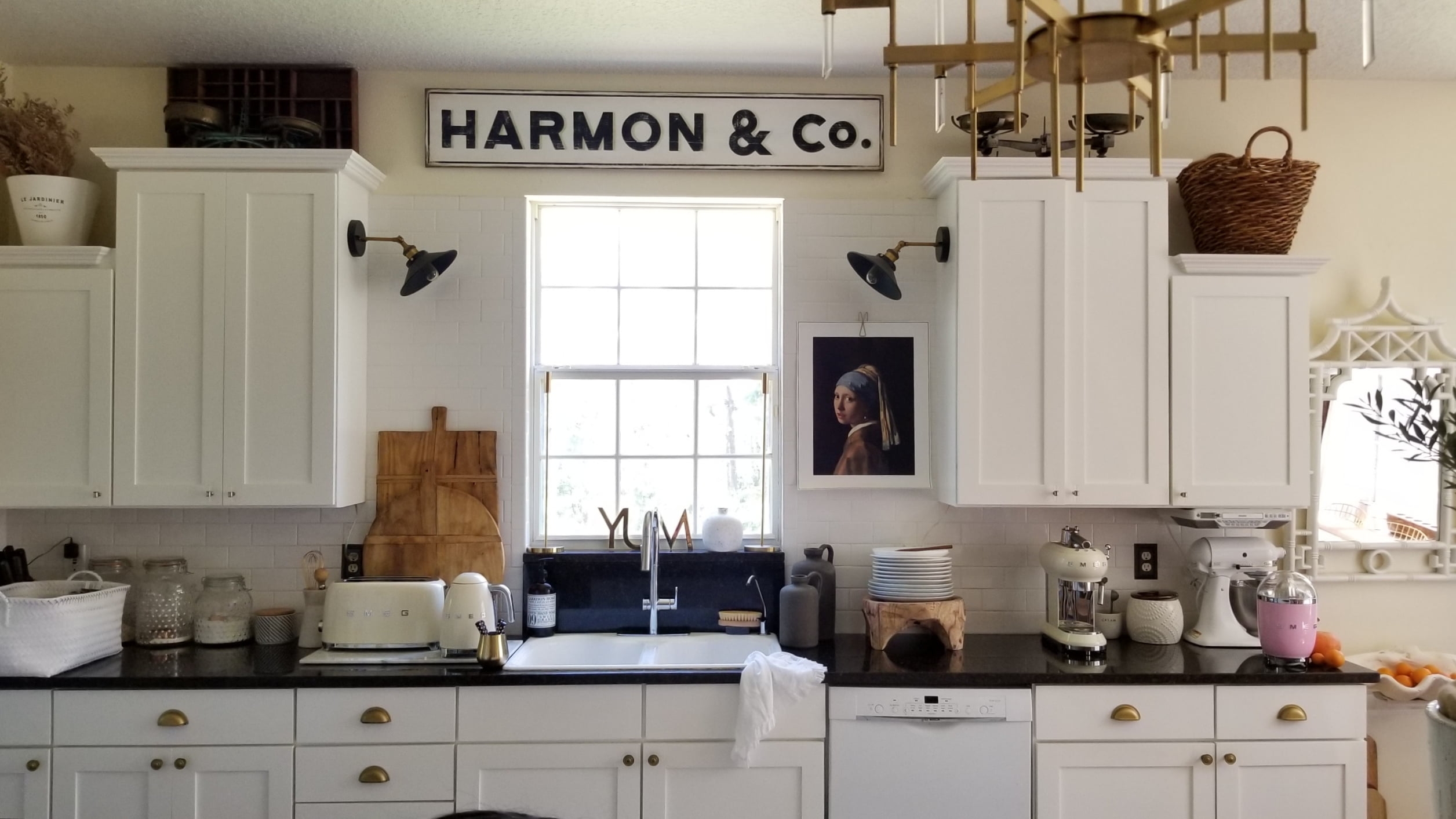 White Modern Industrial Farmhouse Kitchen Sink Faucet SMEG appliances Art Breadboards Country Living Interior Design Decor Rustic Eclectic Fixerupper Black Granite Countertops White Cabinets