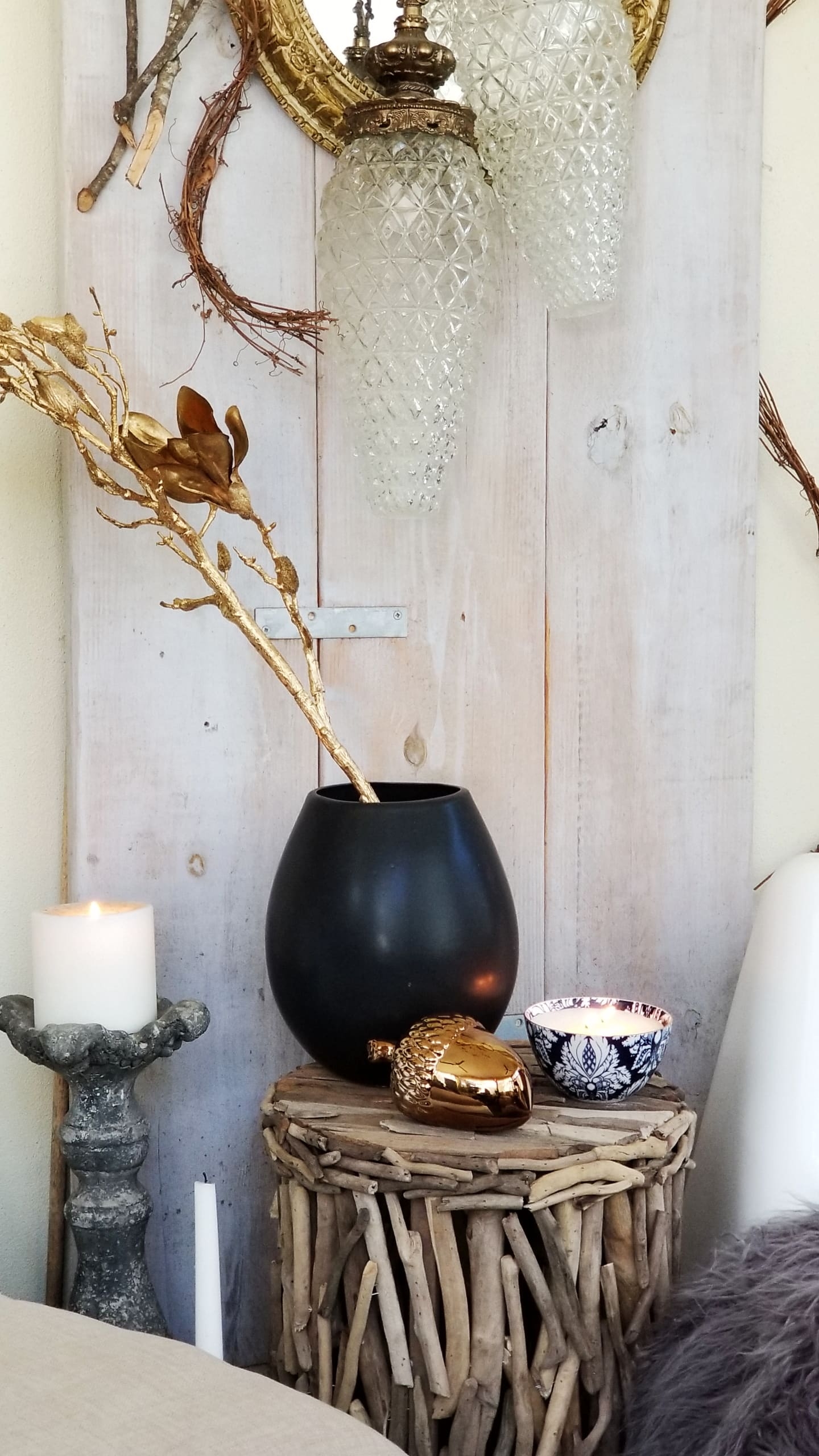 Fall At Home Decor Store Design Inspiration Back Porch Bohemian Eclectic Chic Boho Rustric retreat fur jewel tones pumpkins acorns gold lanterns candles throws pillows plants branches candles cozy wood autumn decor harvest vase macrame rug 