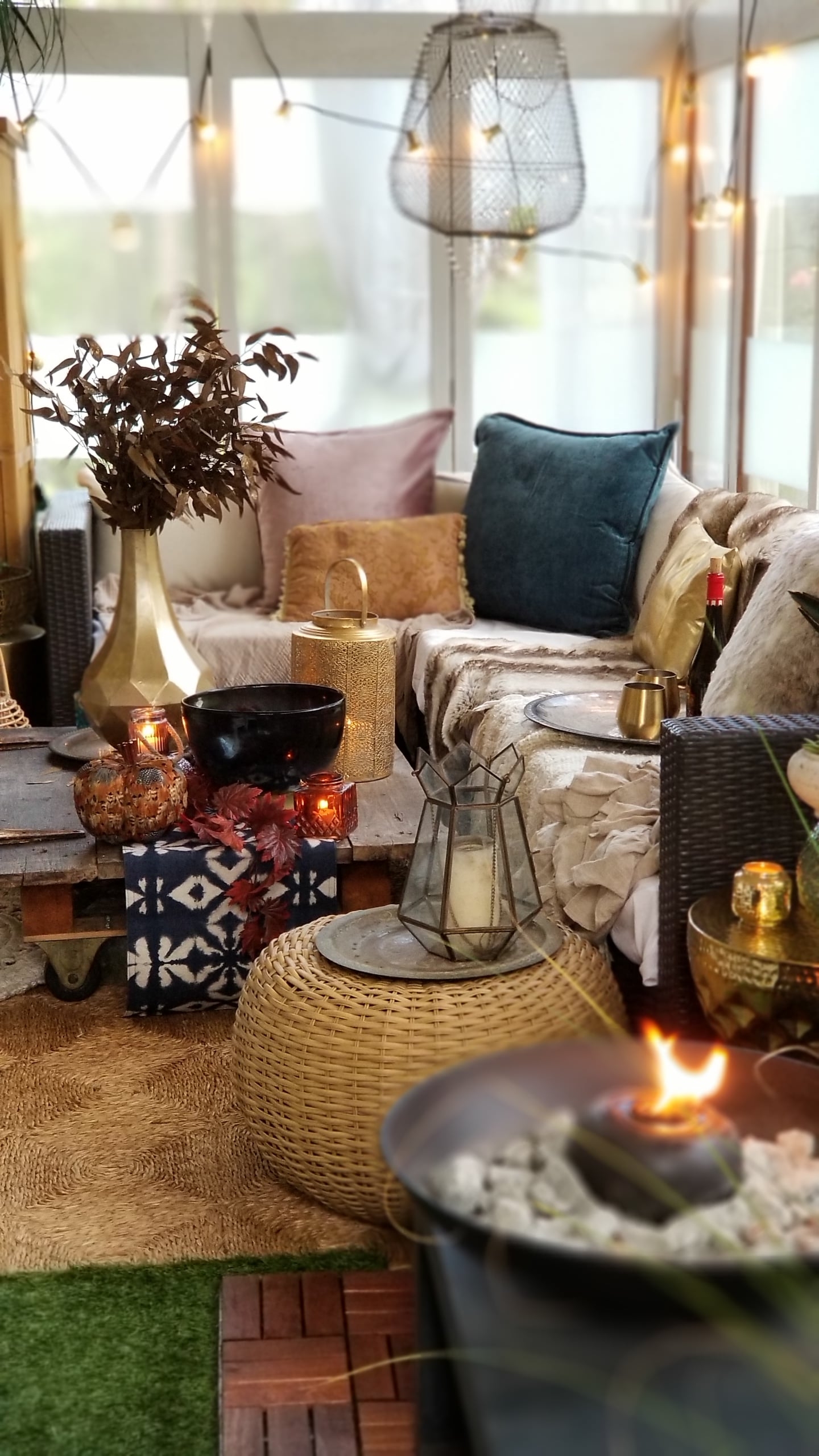 Fall At Home Decor Store Design Inspiration Back Porch Bohemian Eclectic Chic Boho Rustric retreat fur jewel tones pumpkins acorns gold lanterns candles throws pillows plants branches candles cozy wood autumn decor harvest vase macrame rug 