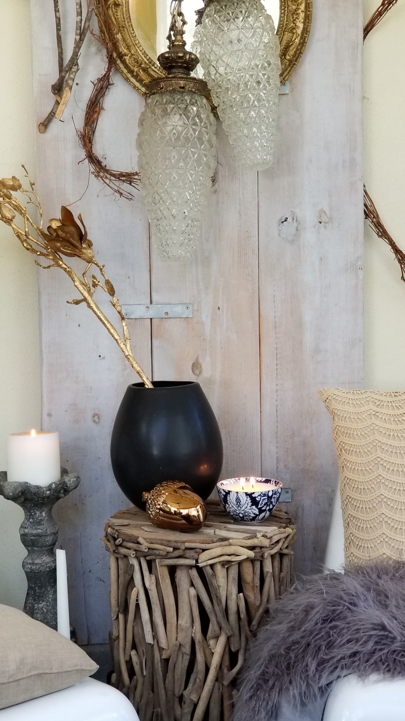 Fall At Home Decor Store Design Inspiration Back Porch Bohemian Eclectic Chic Boho Rustric retreat fur jewel tones pumpkins acorns gold lanterns candles throws pillows plants branches candles cozy wood autumn decor harvest vase macrame rug 