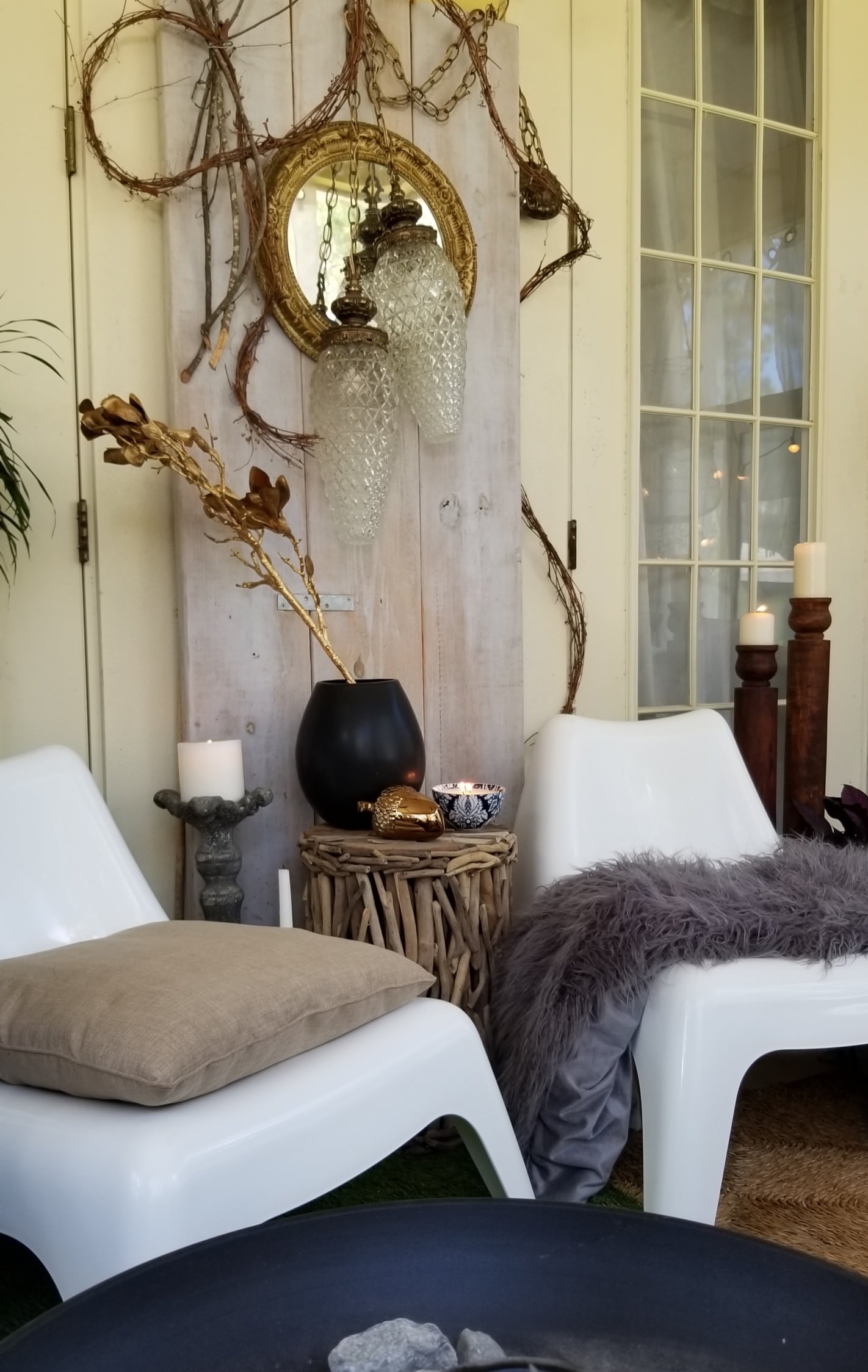 Fall At Home Decor Store Design Inspiration Back Porch Bohemian Eclectic Chic Boho Rustric retreat fur jewel tones pumpkins acorns gold lanterns candles throws pillows plants branches candles cozy wood autumn decor harvest vase macrame rug 