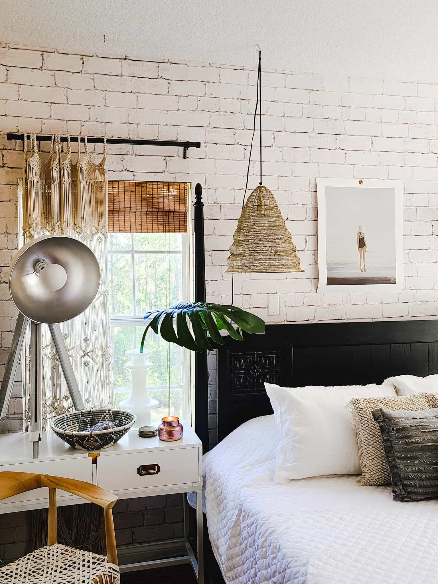 Gallery Wall Home Decor Bedroom Accessories Interior Design Master Bedroom makeover refresh industrial modern boho chic texture black and white baskets cowhide bedding bamboo mirror Joss & Main