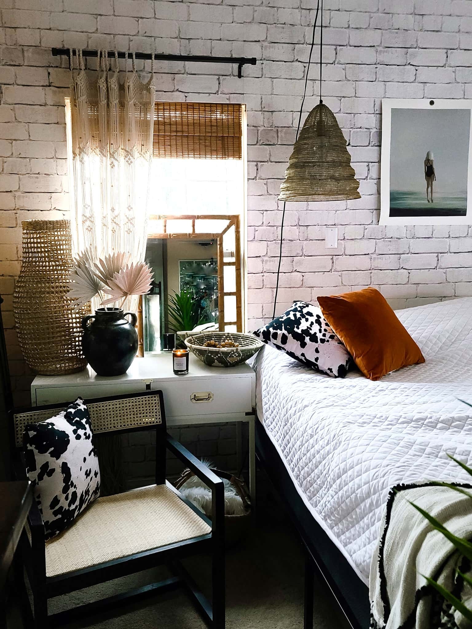 Gallery Wall Home Decor Bedroom Accessories Interior Design Master Bedroom makeover refresh industrial modern boho chic texture black and white baskets cowhide bedding bamboo mirror Joss & Main