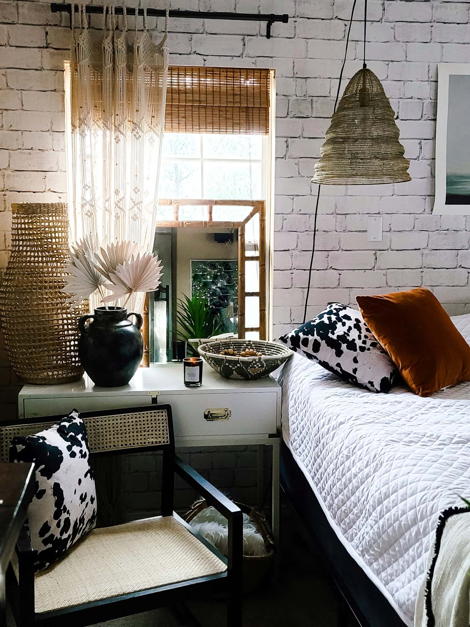 Gallery Wall Home Decor Bedroom Accessories Interior Design Master Bedroom makeover refresh industrial modern boho chic texture black and white baskets cowhide bedding bamboo mirror Joss & Main