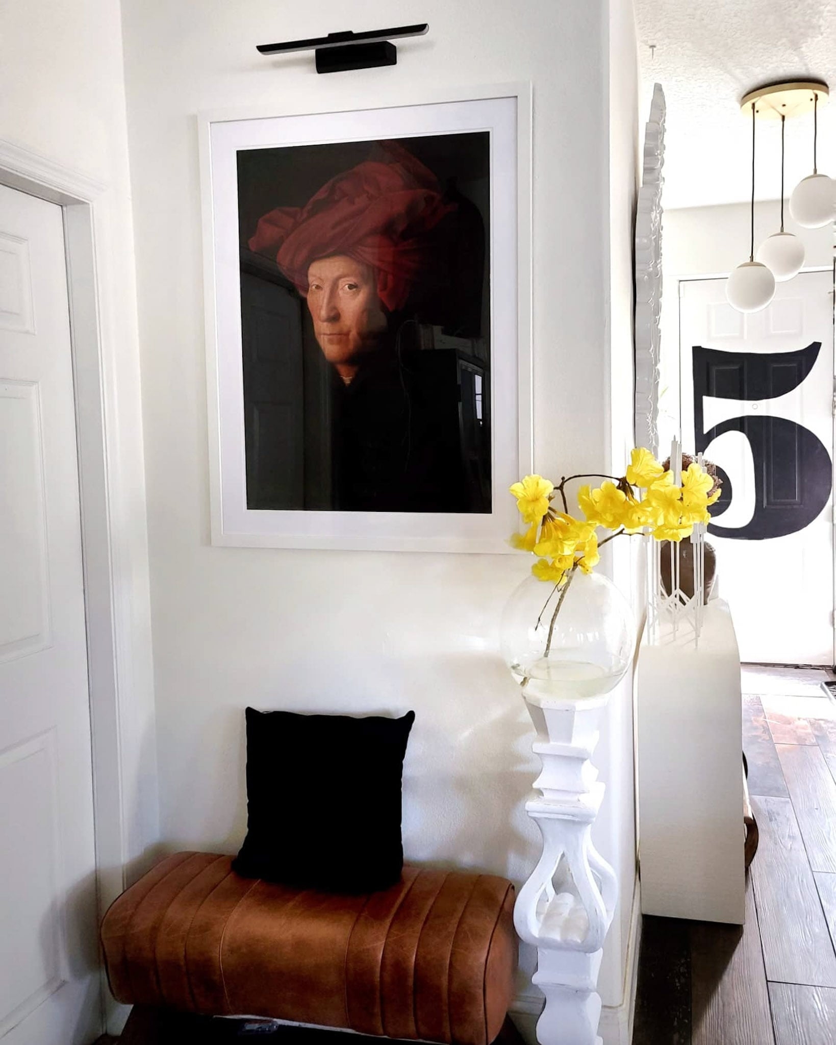 Entryway Foyer Decor with a mix of Scandinavian modern farmhouse style and a hygge cozy feel. Art, rugs and decor.